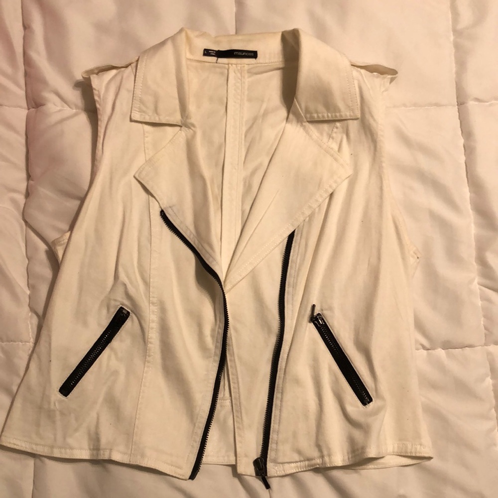 Cute white vest with black zippers and pockets.